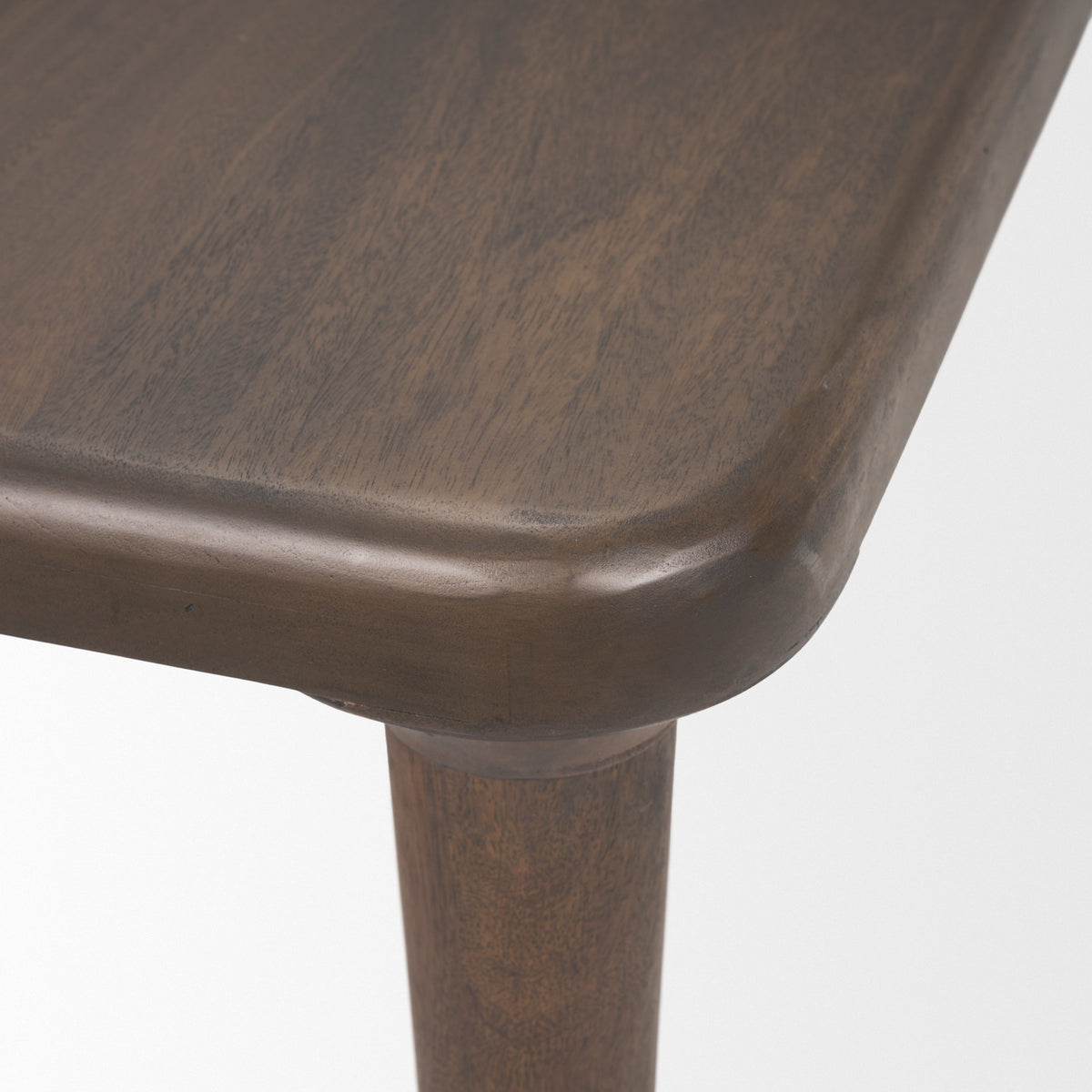 Suvan dining table in med-dark brown, leg detail