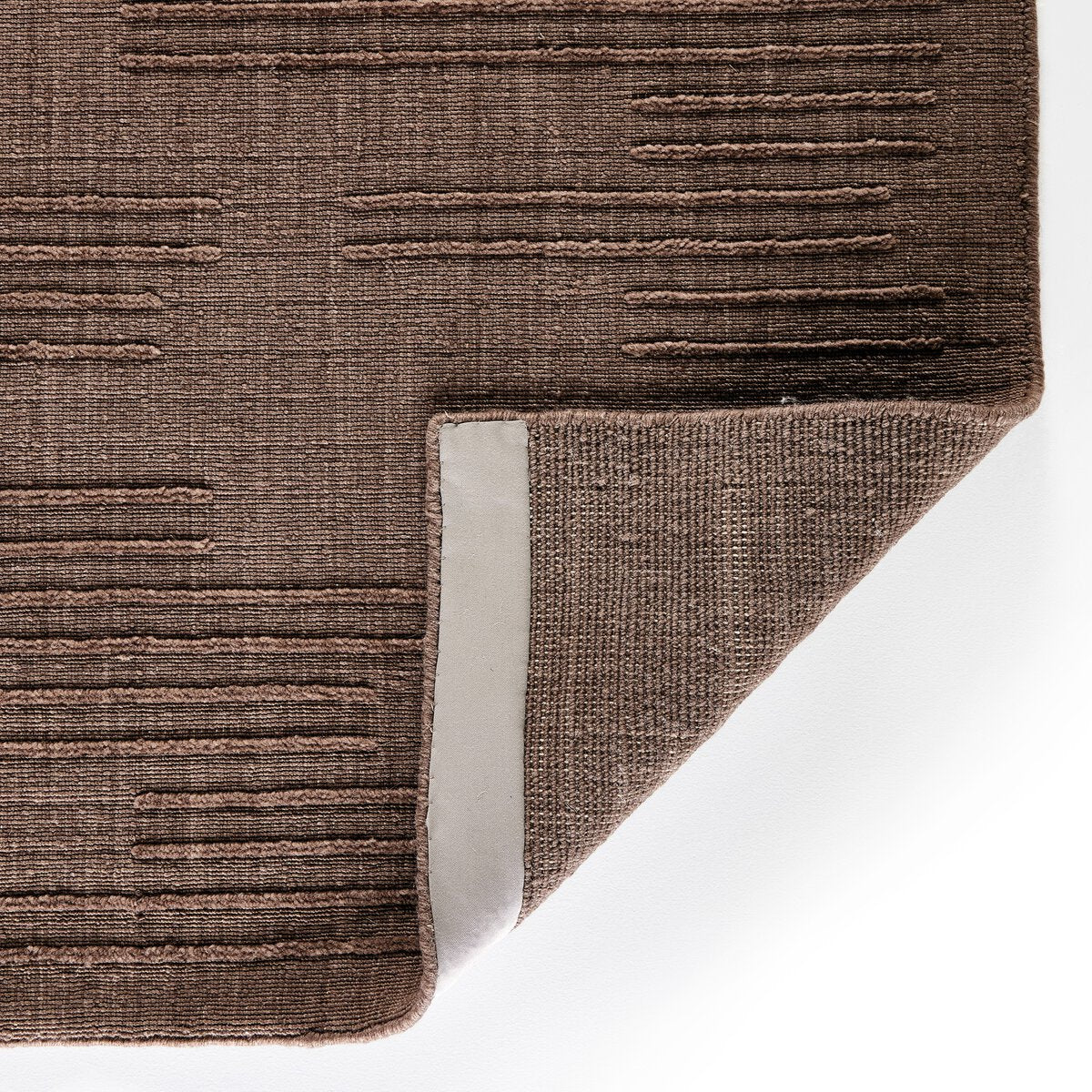 Detail of raised broken-stripe texture in Akara Taupe