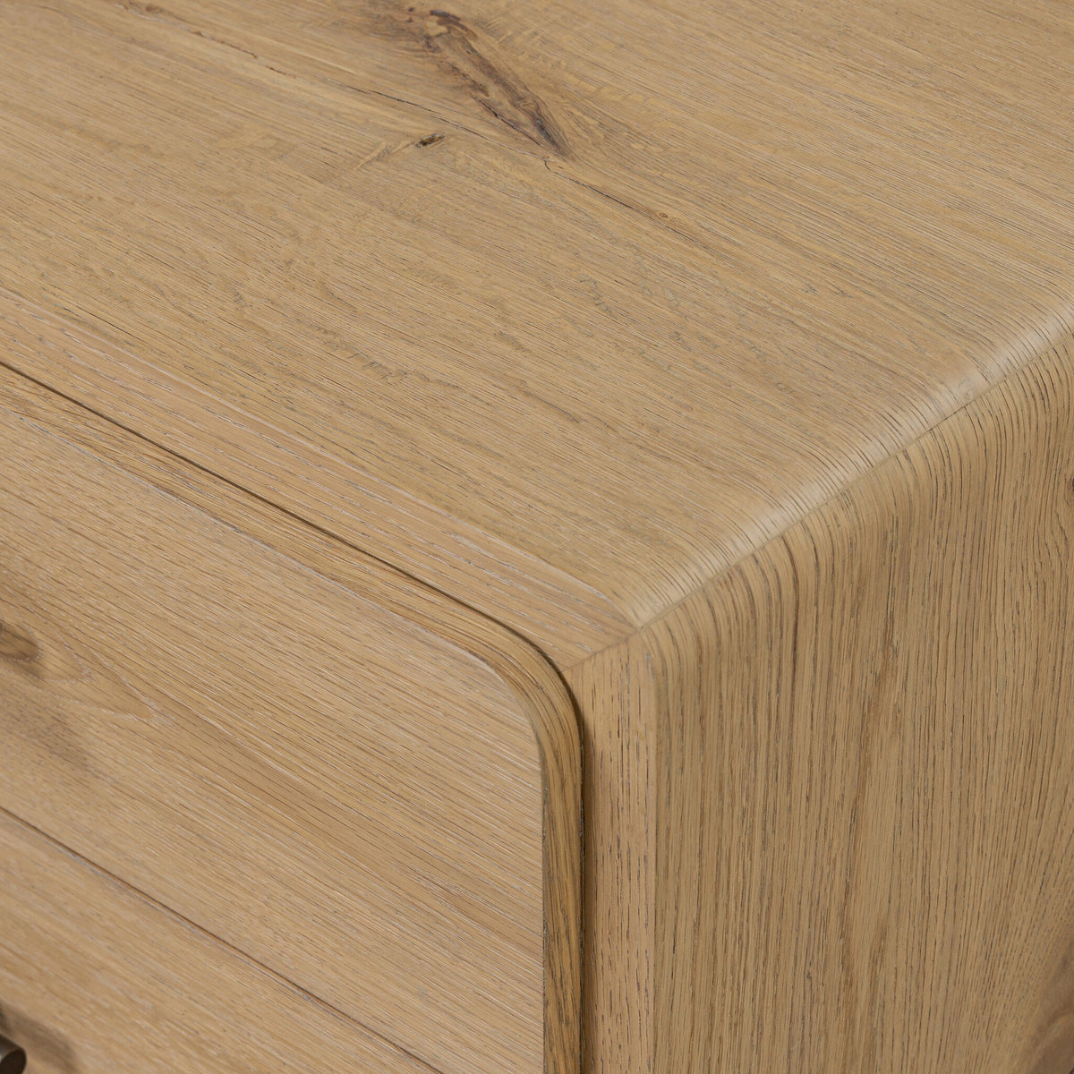 Detail of the Eden Nightstand aged bronze and wood drawer pull