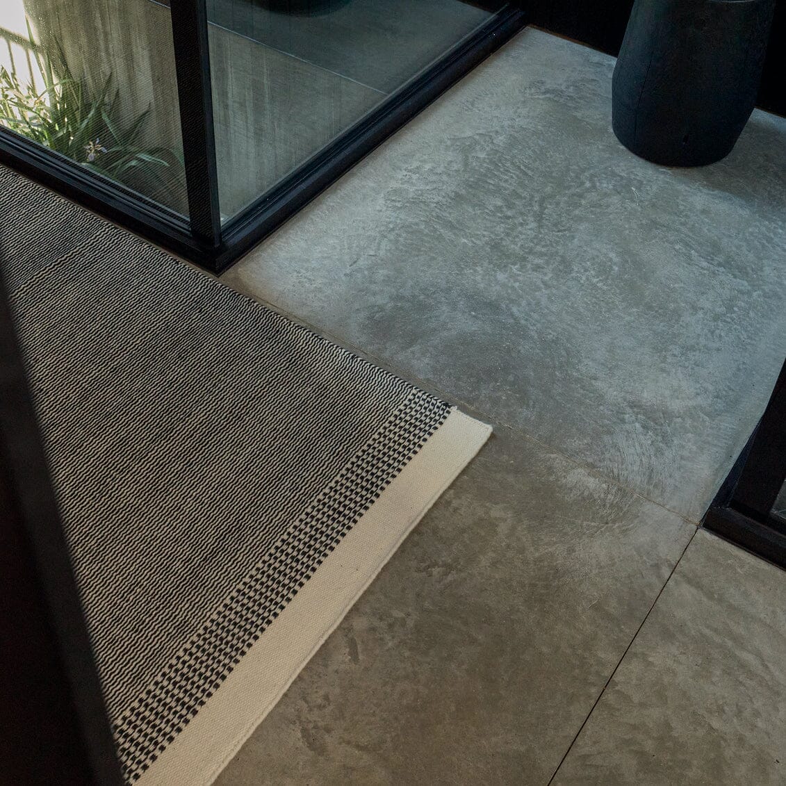 Fable Linear Wool Rug styled in entryway