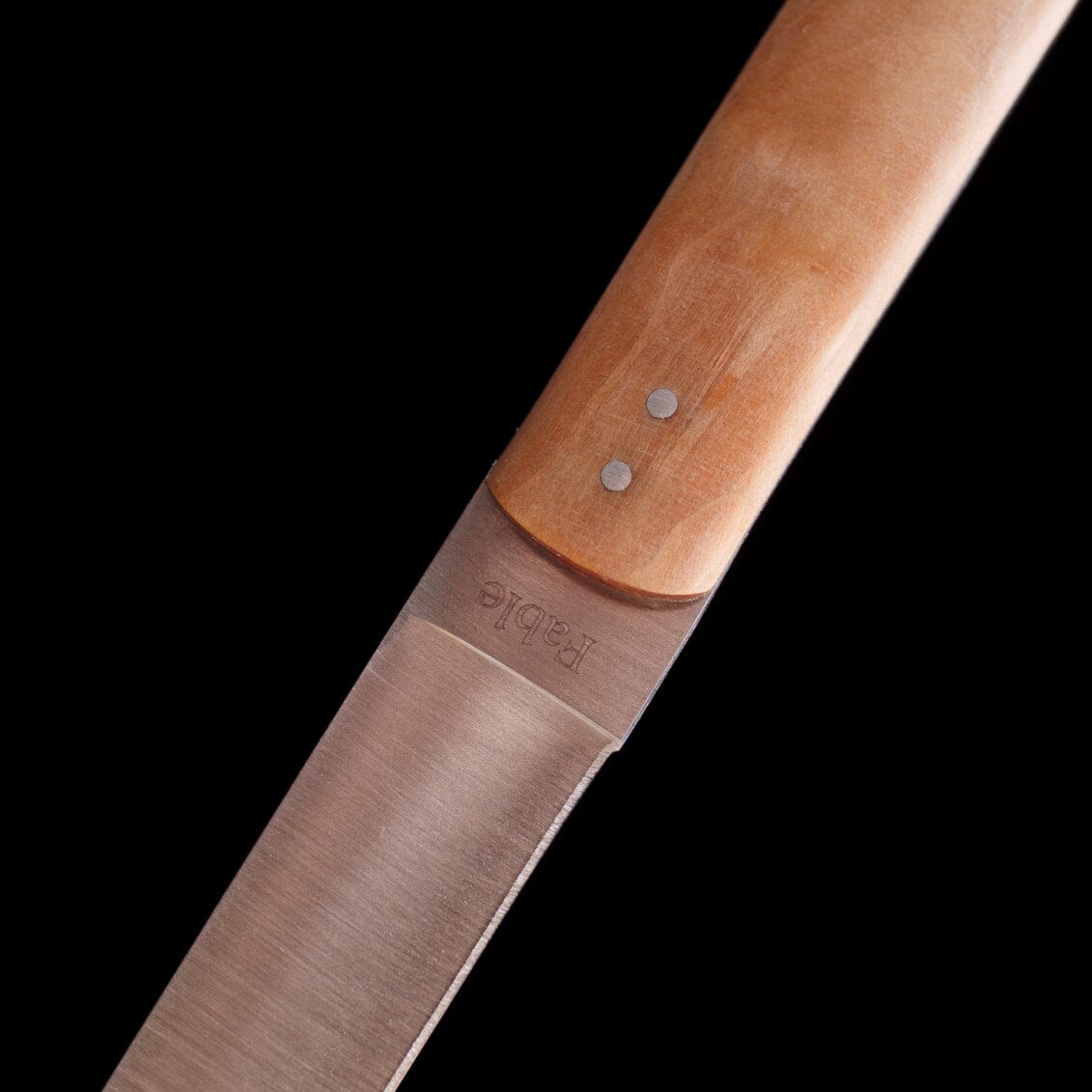 Close-up of Fable steak knife with wooden handle