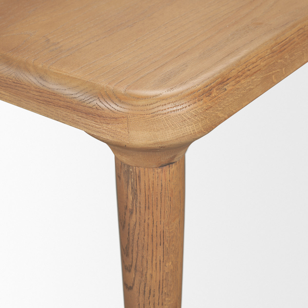 Suvan dining table, tapered leg detail