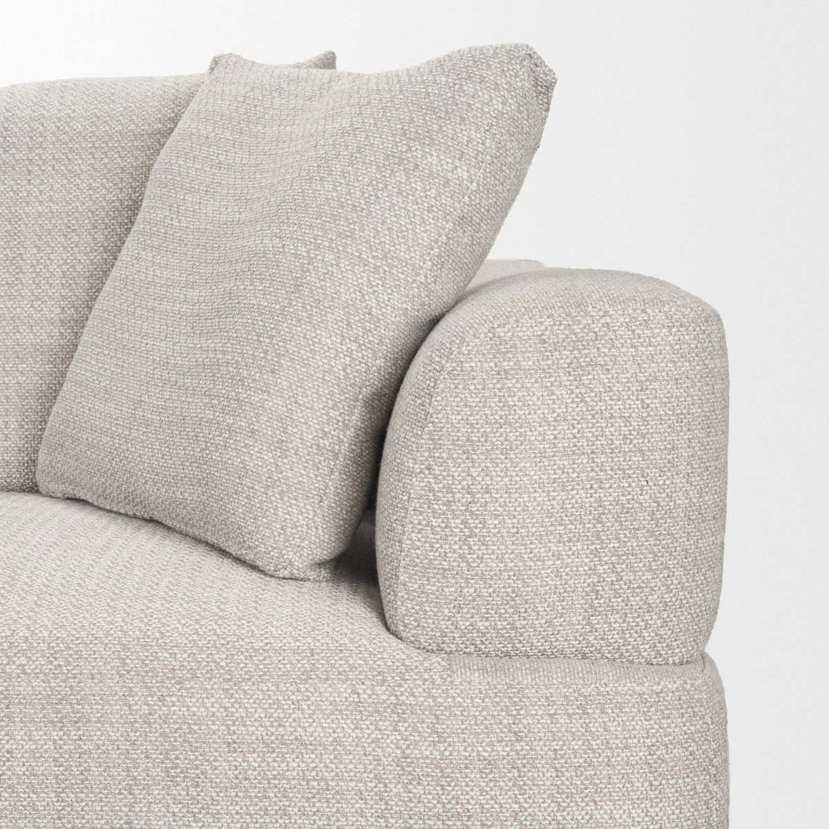 Gray textured sofa with a pillow on a white background