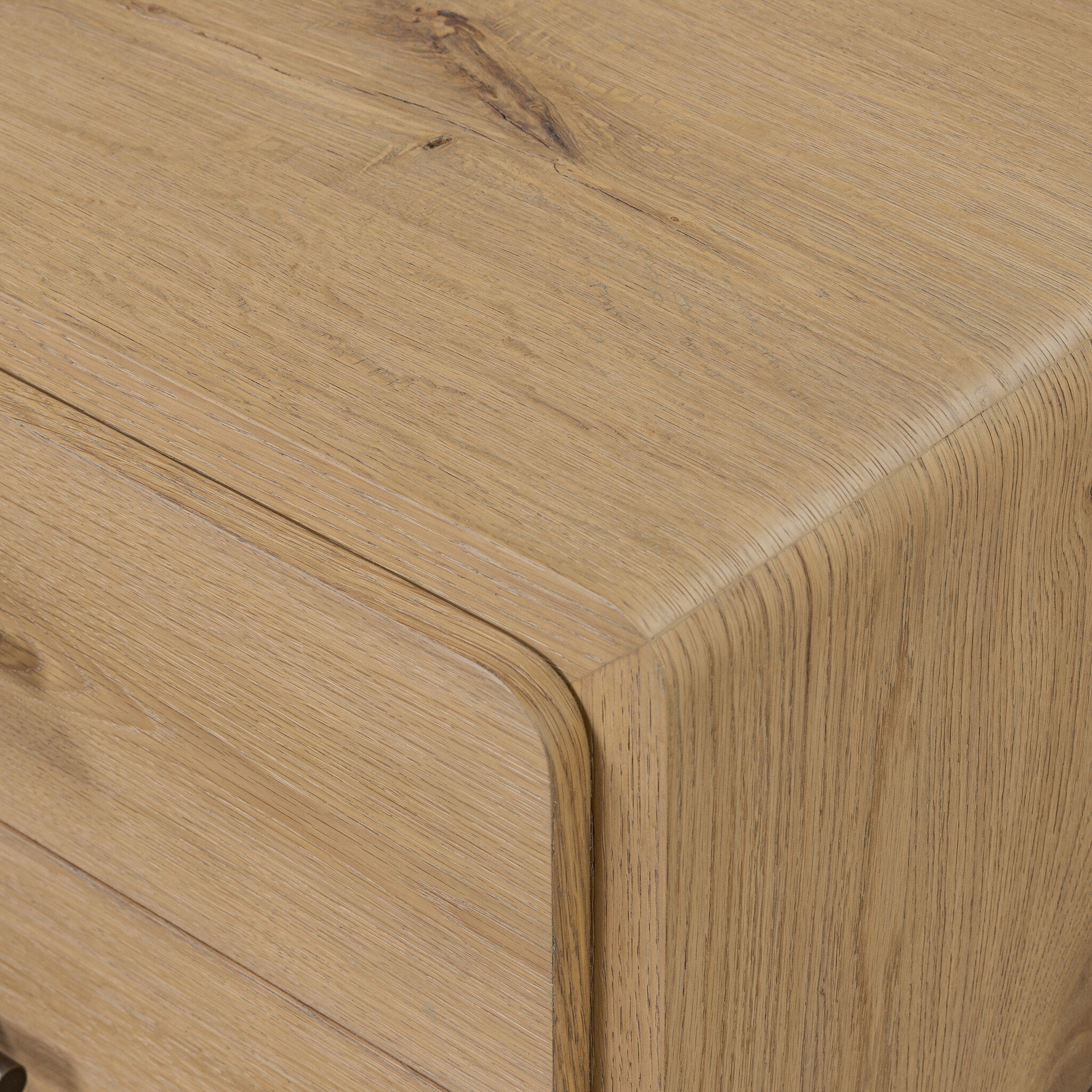 Detail of the Eden Nightstand aged bronze and wood drawer pull