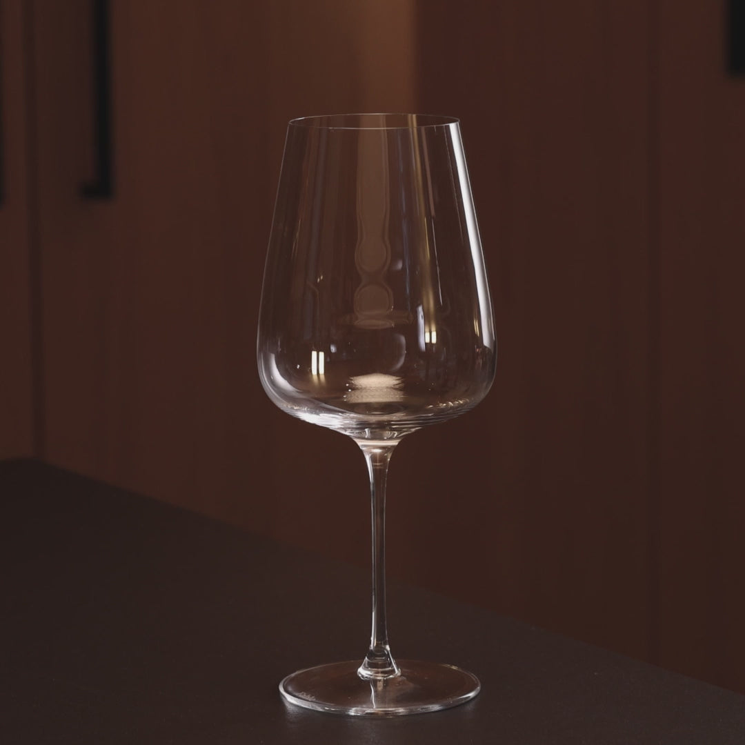 Red wine poured into crystal Cabernet wine glass, Fable wine glasses set of 4